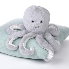 Inky features white pompoms along tentacles for playful nursery decor.