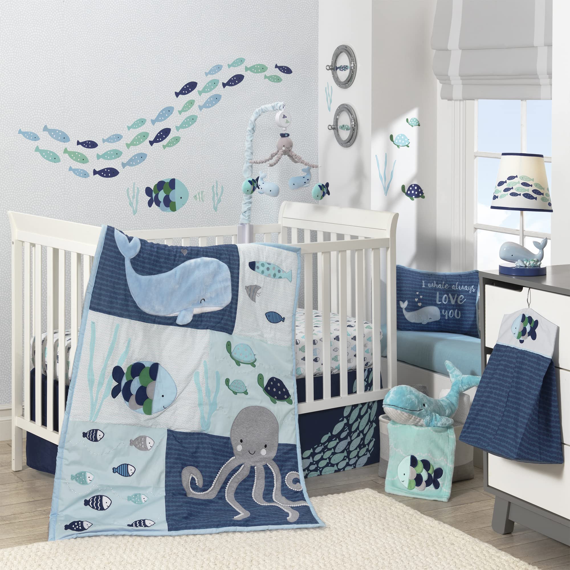 Lambs & Ivy Oceania Hoku plush whale close-up with embroidered eyes for safe play.