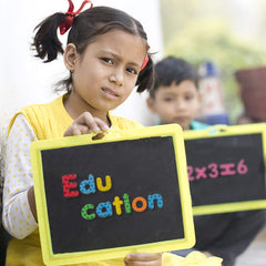 Laxdacee alphabet magnets on magnetic boards facilitate quick spelling games.