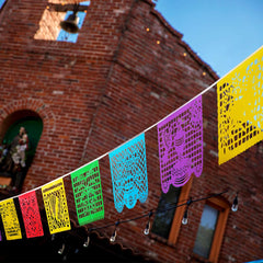 Lctevvn party banners create a festive ambiance for Dia de los Muertos and birthdays.