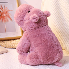 Leahaoe cuddle time hippo plush in warm, cozy setup.