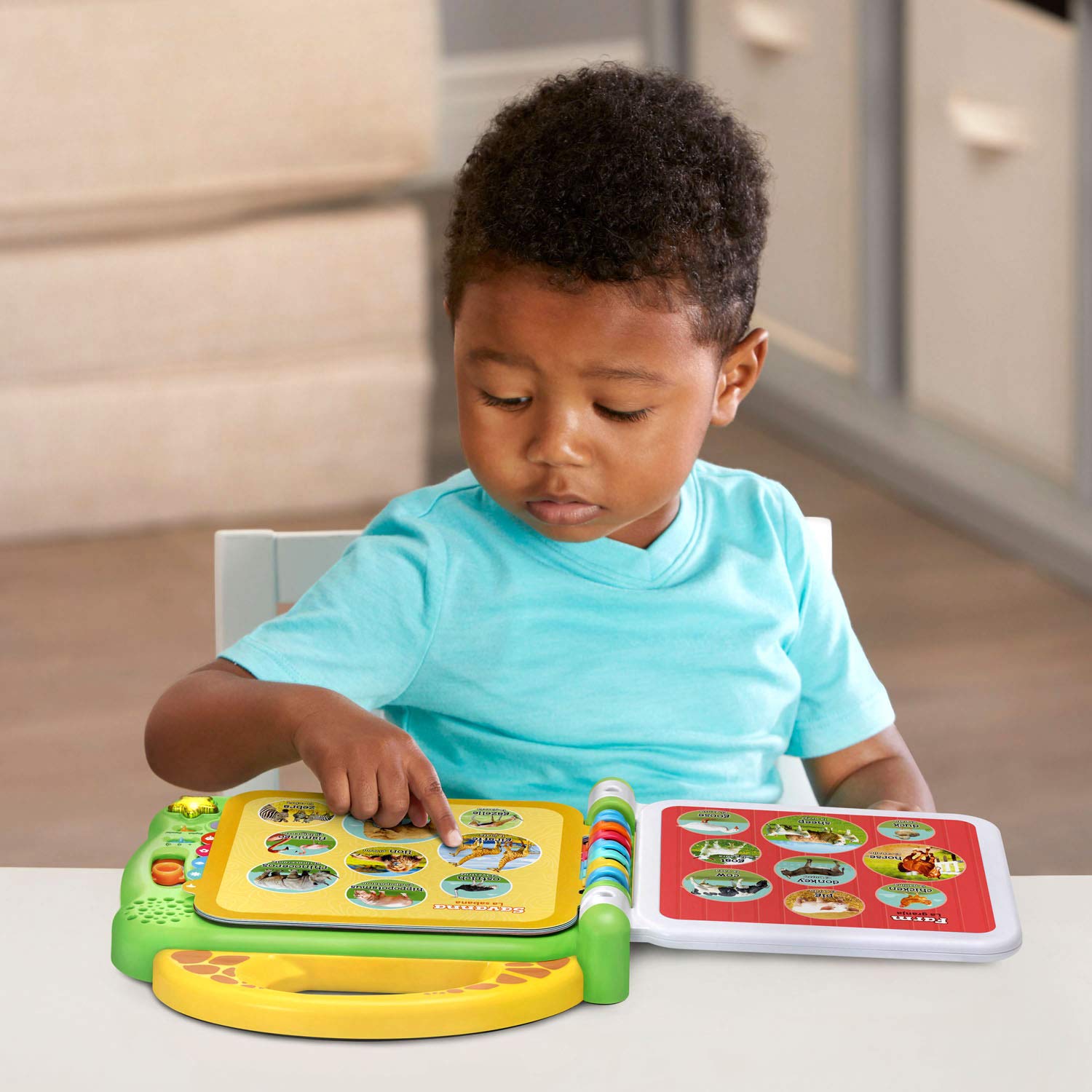 LeapFrog 100 Animals Book bilingual songs mode supports English and Spanish learning.