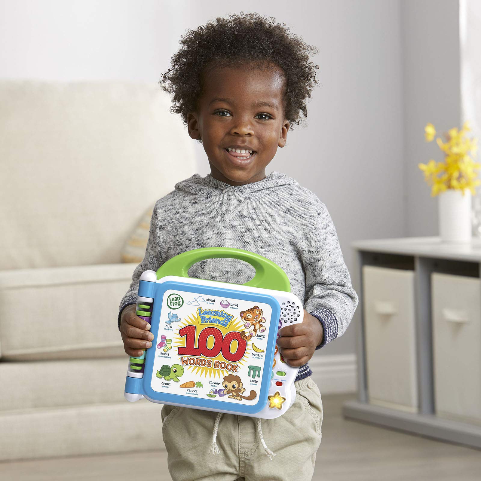 LeapFrog Learning Friends 100 Words Book bilingual language switch enables English and Spanish practice.