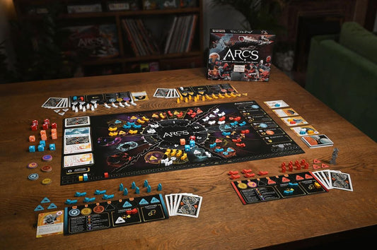 Leder Games Arcs engraved dice highlight tactile strategy and fast combat decisions.