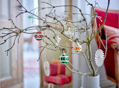LEGO Christmas Ornament Set topper silhouette makes a memorable holiday shelf centerpiece.