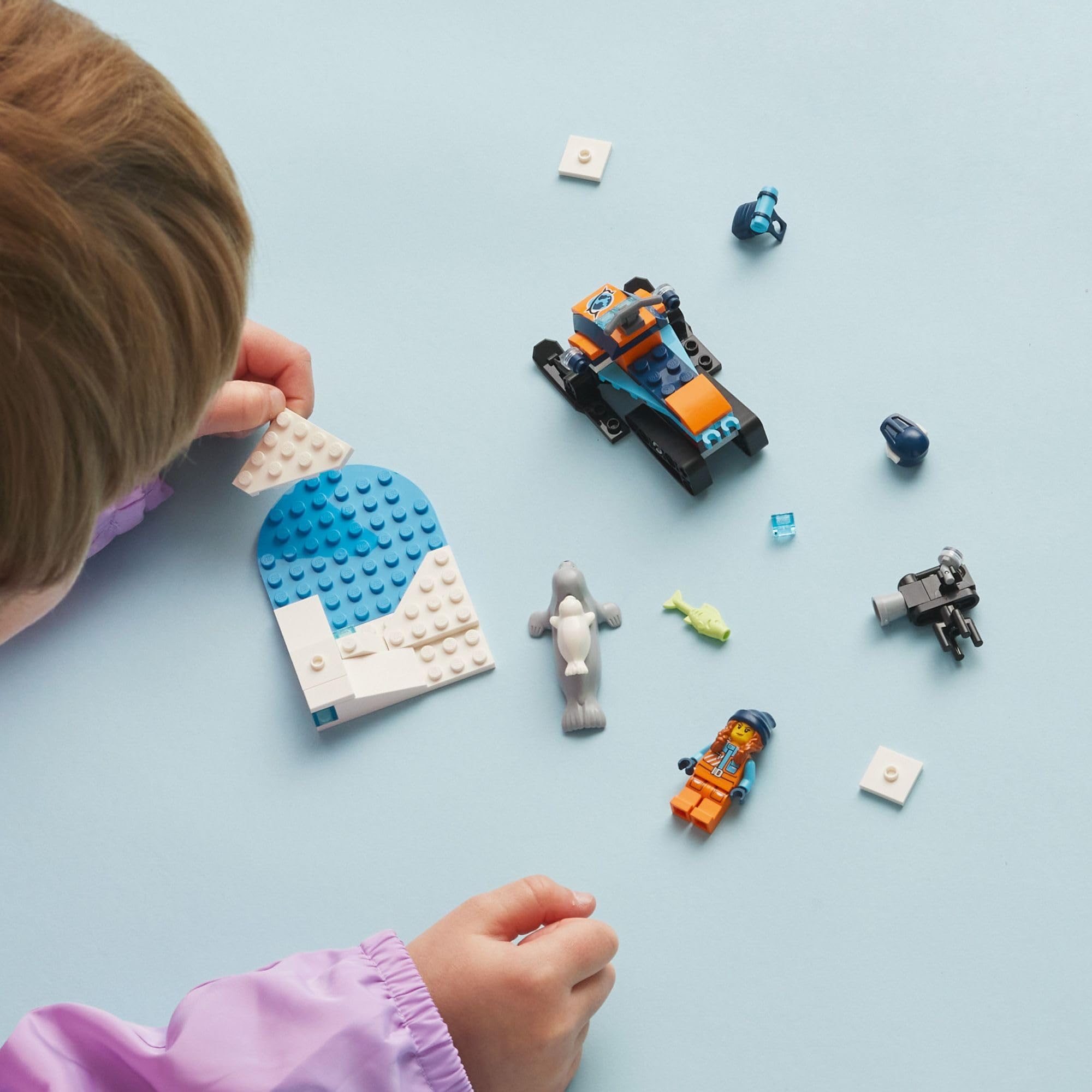 LEGO City Arctic Explorer seal figures enhance icy scene play.