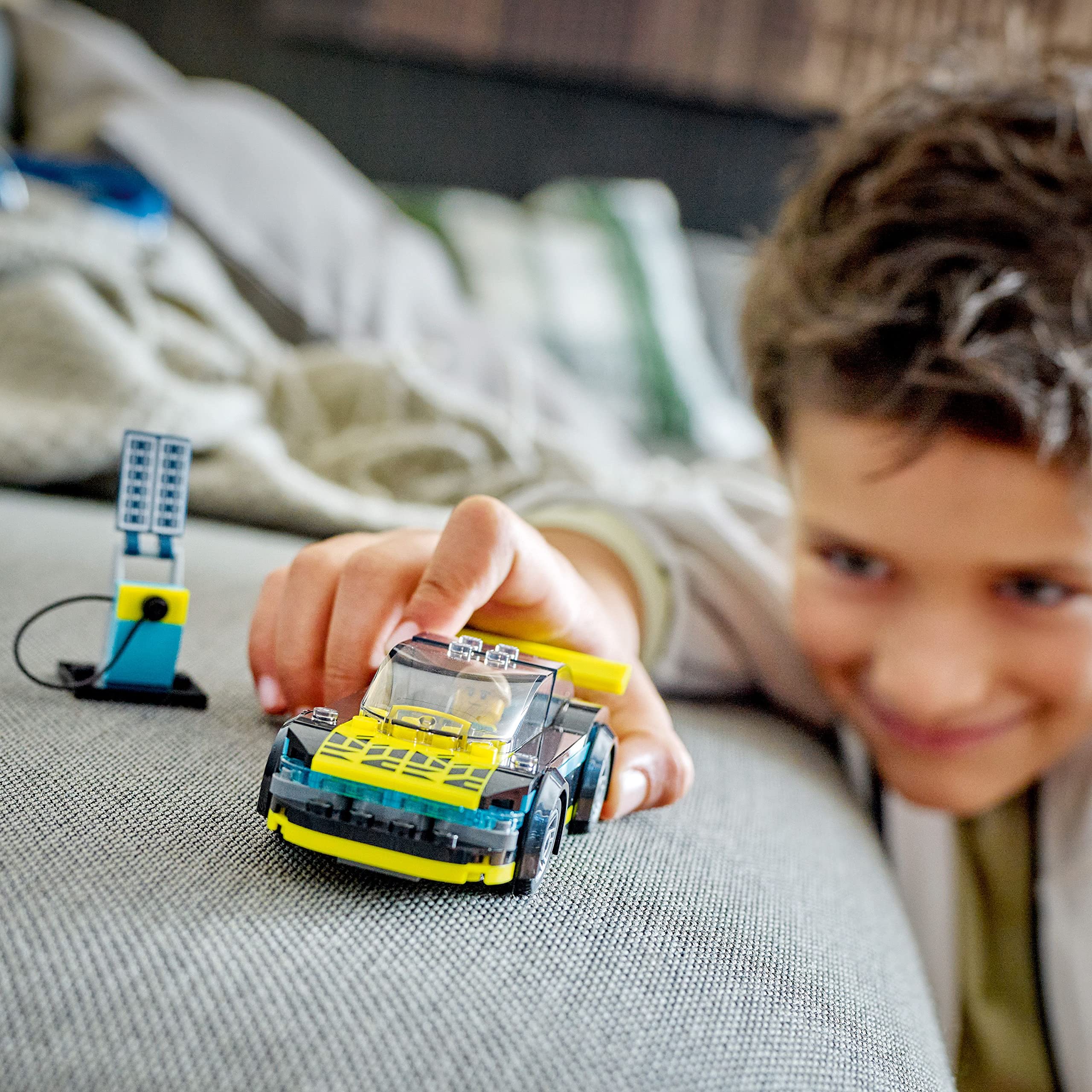 LEGO City Electric Sports Car includes racing driver minifigure for authentic races.