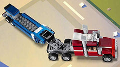 LEGO Creator 3in1 Shuttle Transporter car with caravan scene on the road.