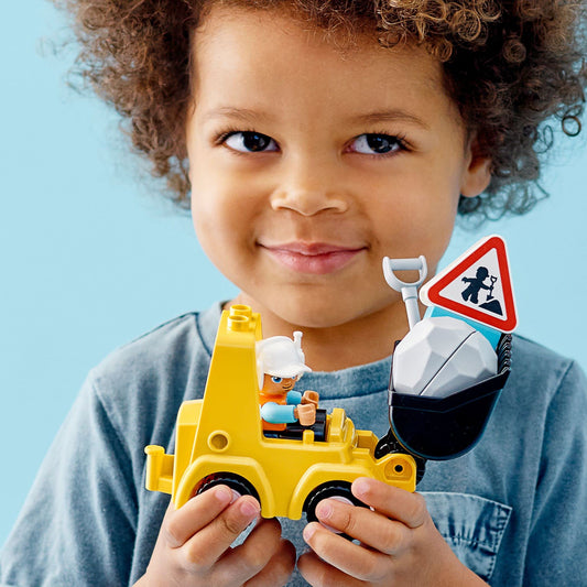 LEGO DUPLO bulldozer scoop action supports fine motor control during play