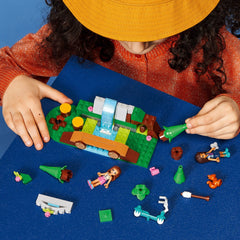 LEGO Friends forest waterfall bridge; supports collaborative play and river-crossing adventures