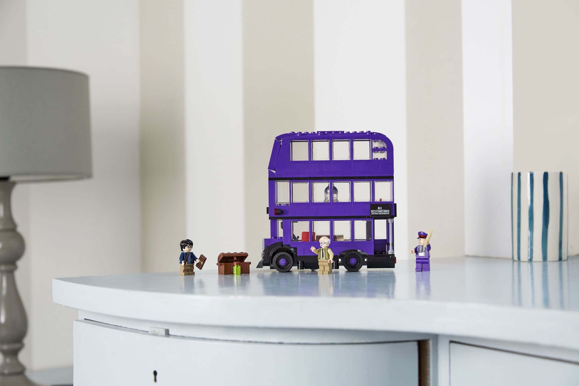 LEGO Knight Bus trunk loading scene with minifigures ready for departure.