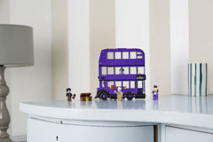 LEGO Knight Bus trunk loading scene with minifigures ready for departure.
