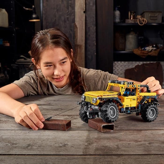 LEGO Jeep Wrangler 42122 axle articulation suspension supports obstacle-ready adventures.