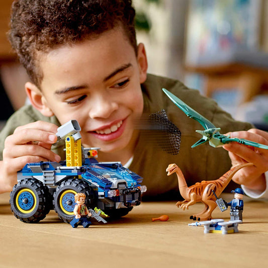 LEGO Jurassic World research vehicle with doors open highlighting dual cockpit and interactive features.