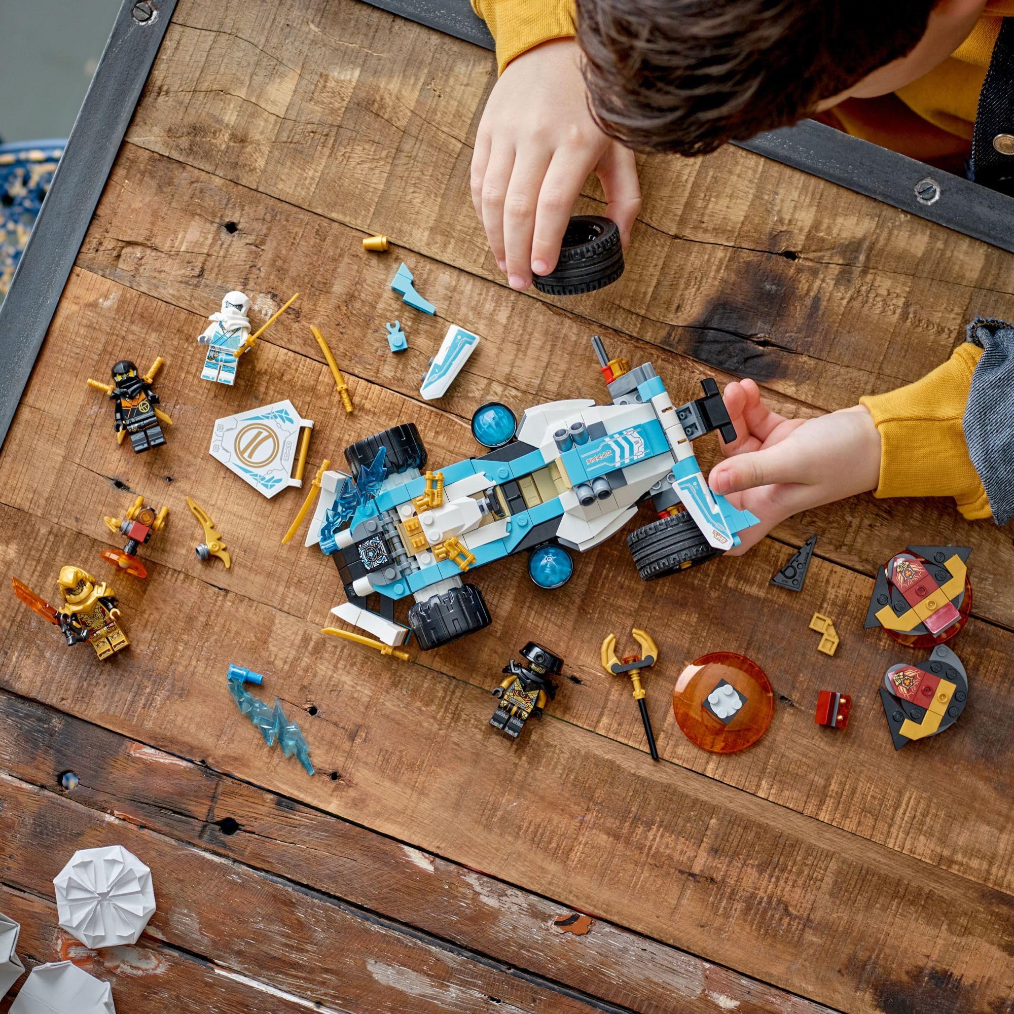 Cole minifigure with dual katanas supports ninja battles.
