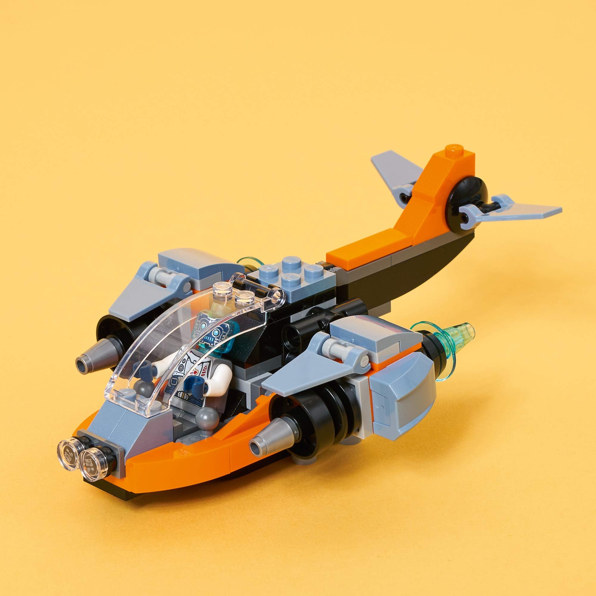 LEGO robot minifigure with transparent blue head joins every build