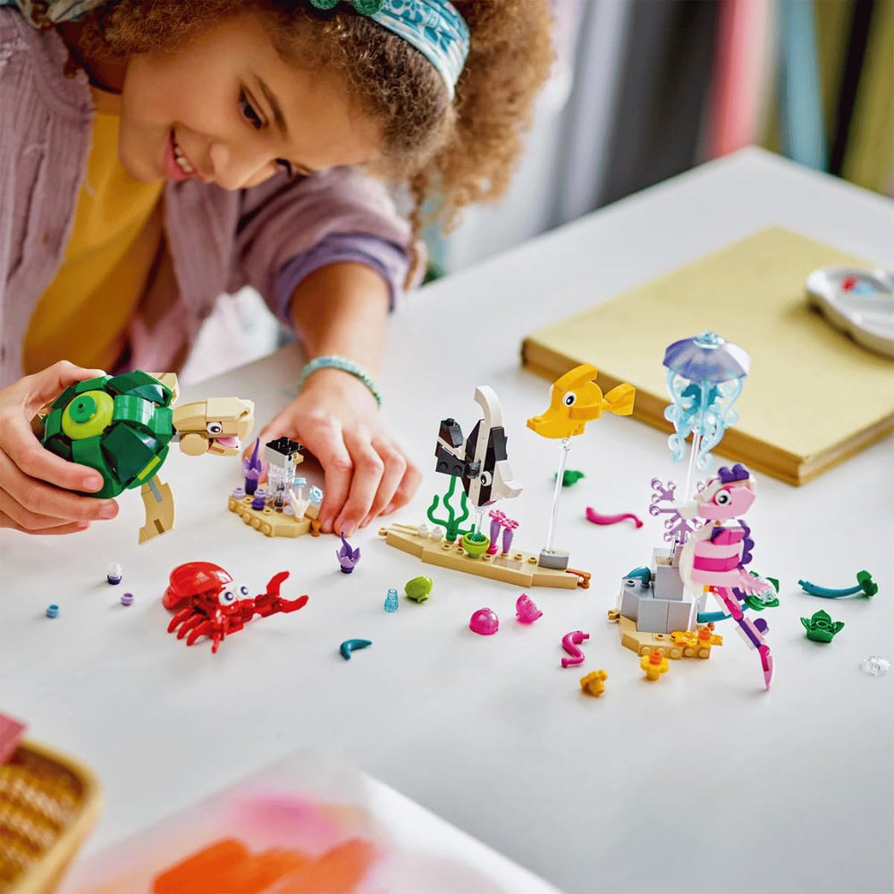 LEGO Sea Animals fish pair glides through colorful plants for lively play.