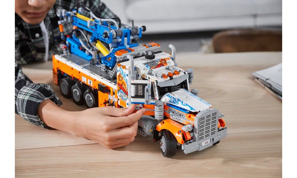 LEGO Technic 42128 side view with outriggers highlighting stability and realism.