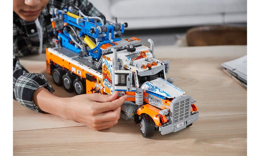 LEGO Technic 42128 side view with outriggers highlighting stability and realism.