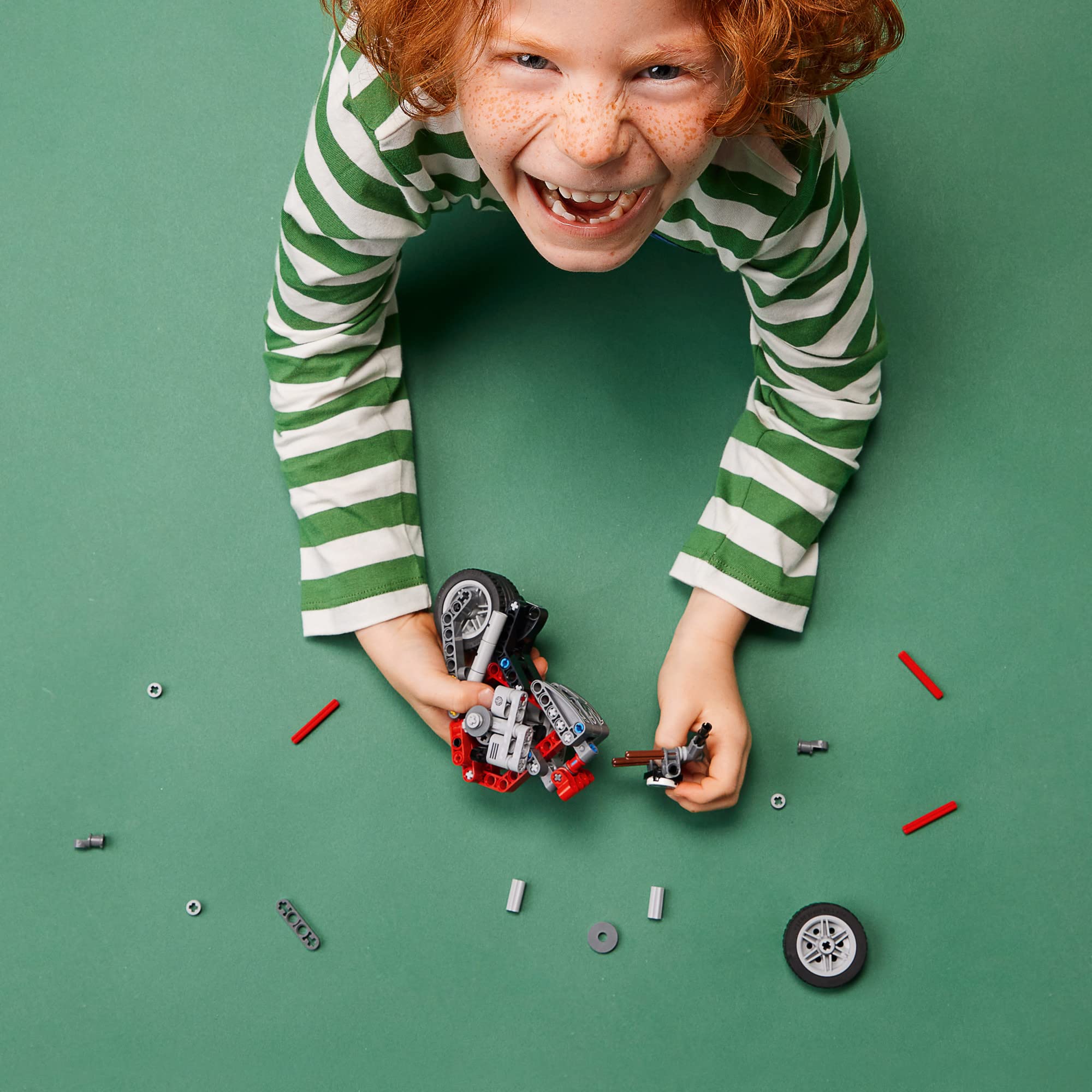 LEGO Technic motorcycle 42132 engine detail emphasizes moving pistons and authentic mechanics