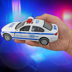 Liberty Imports white-blue police car side view for realistic storytelling.
