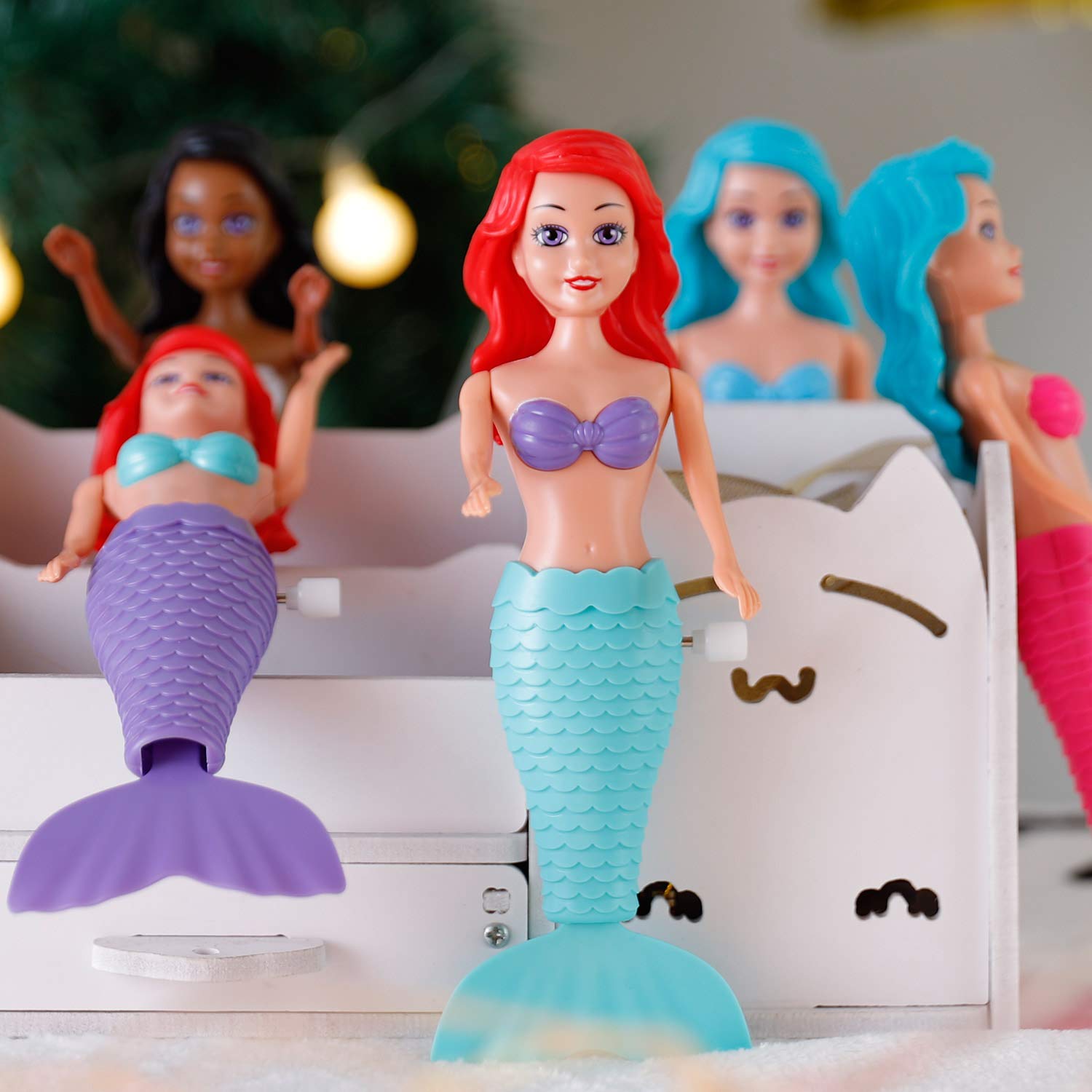 Posable mermaids with articulated arms for imaginative water storytelling