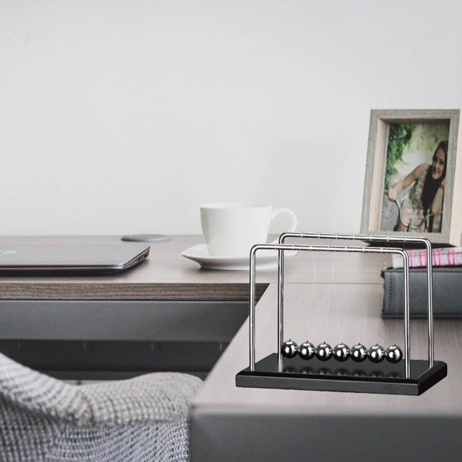 LICRAFT Newton's Cradle with seven stainless steel balls for durable, smooth motion.