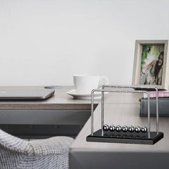 LICRAFT Newton's Cradle with seven stainless steel balls for durable, smooth motion.