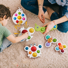 LiKee Fidget Popper baby hand presses bubbles for fine motor play.