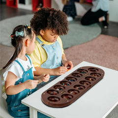Travel-ready Mancala setup, perfect for on-the-go gaming with friends.
