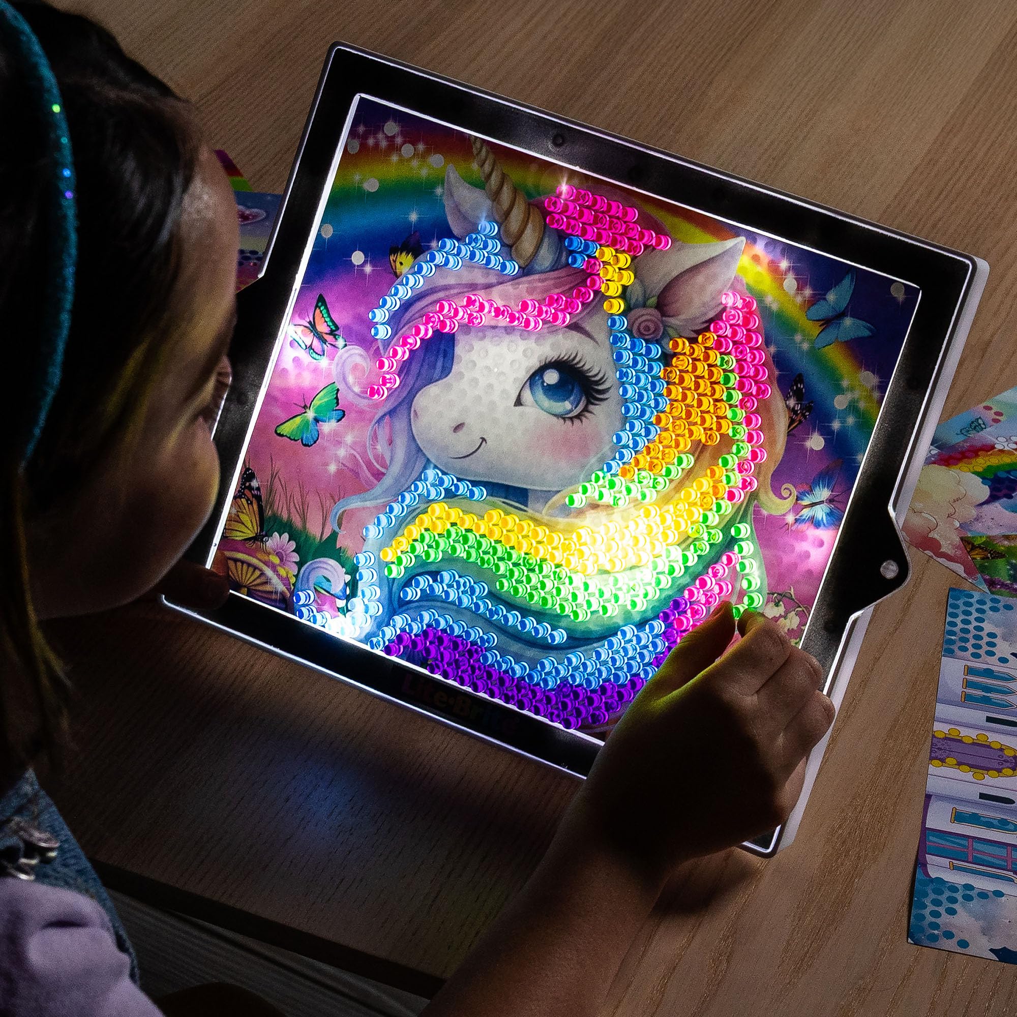 Lite-Brite ColorPOP pull-out easel displaying finished glow-in-the-dark artwork