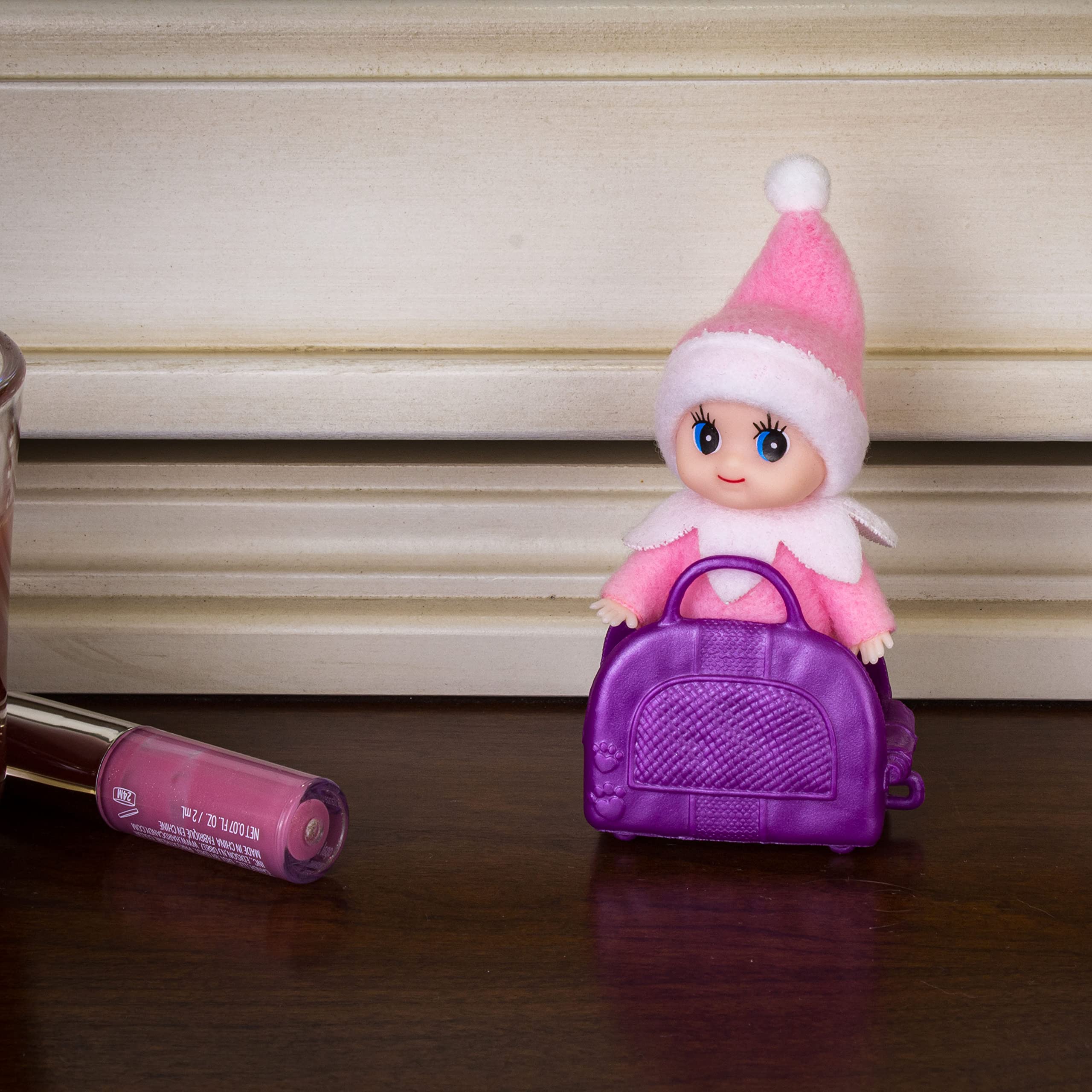 LitoMagic elf doll beside advent calendar prompts to inspire daily tasks.