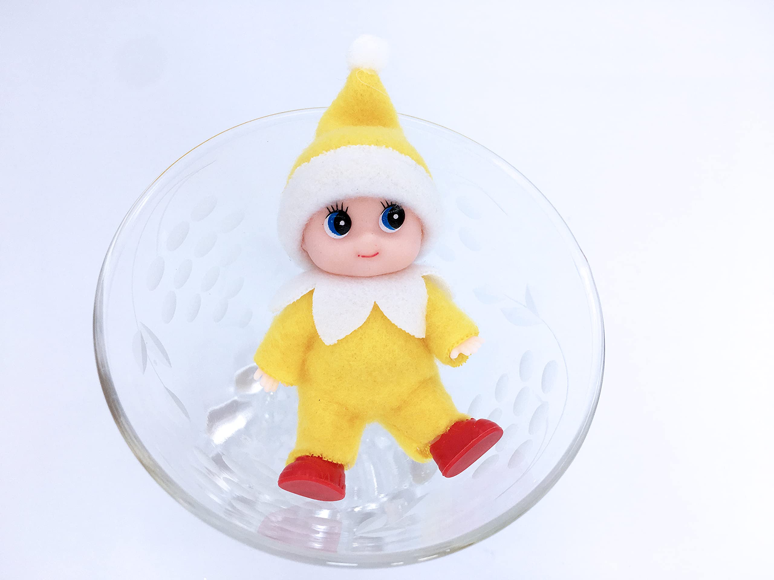 LitoMagic elf doll on shelf, bright yellow jumpsuit brightens holiday decor
