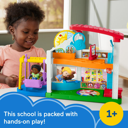 Little People Play for All School art room with smocks supports creative expression
