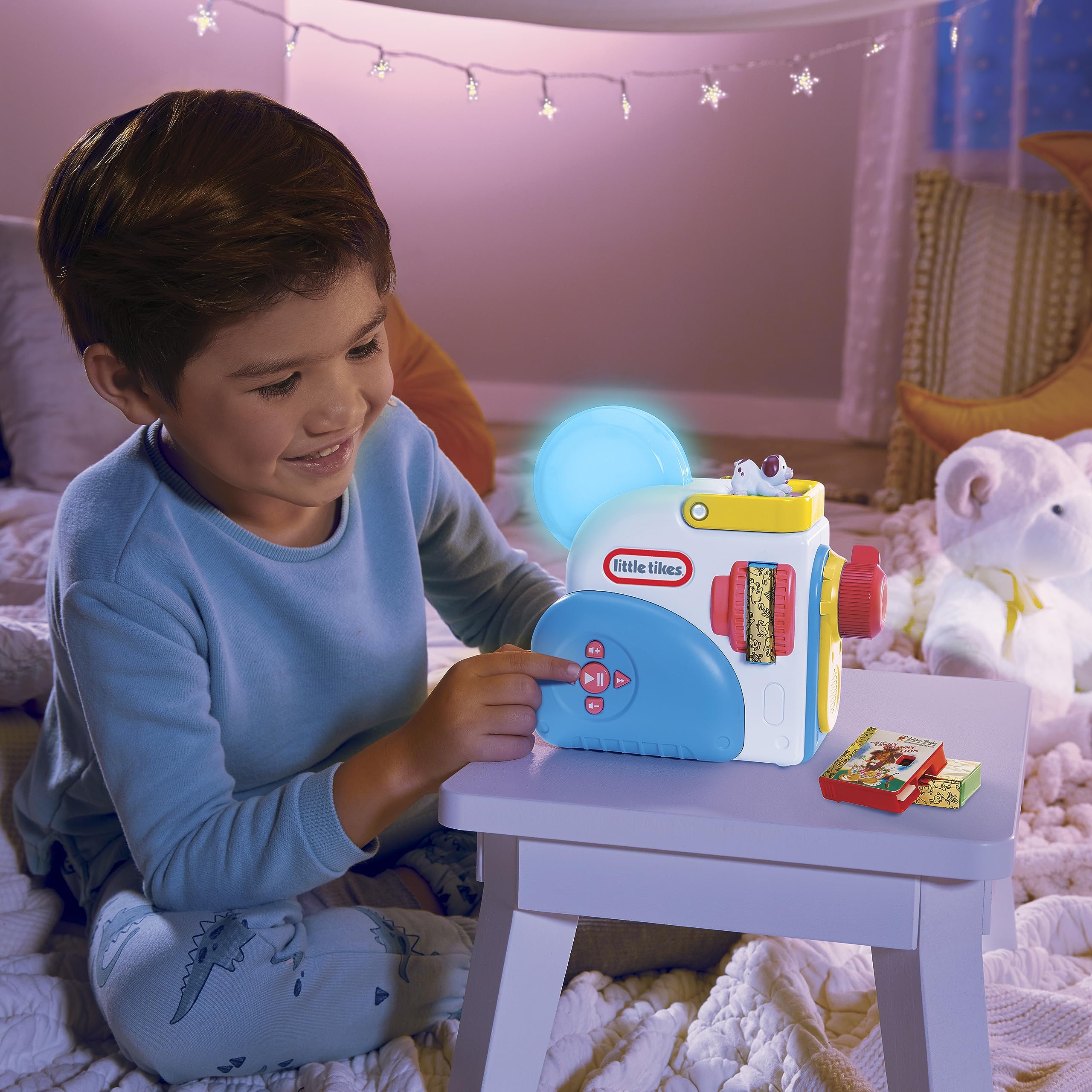 Little Tikes Story Dream Machine cartridge storage: side slots keep stories organized on the go.