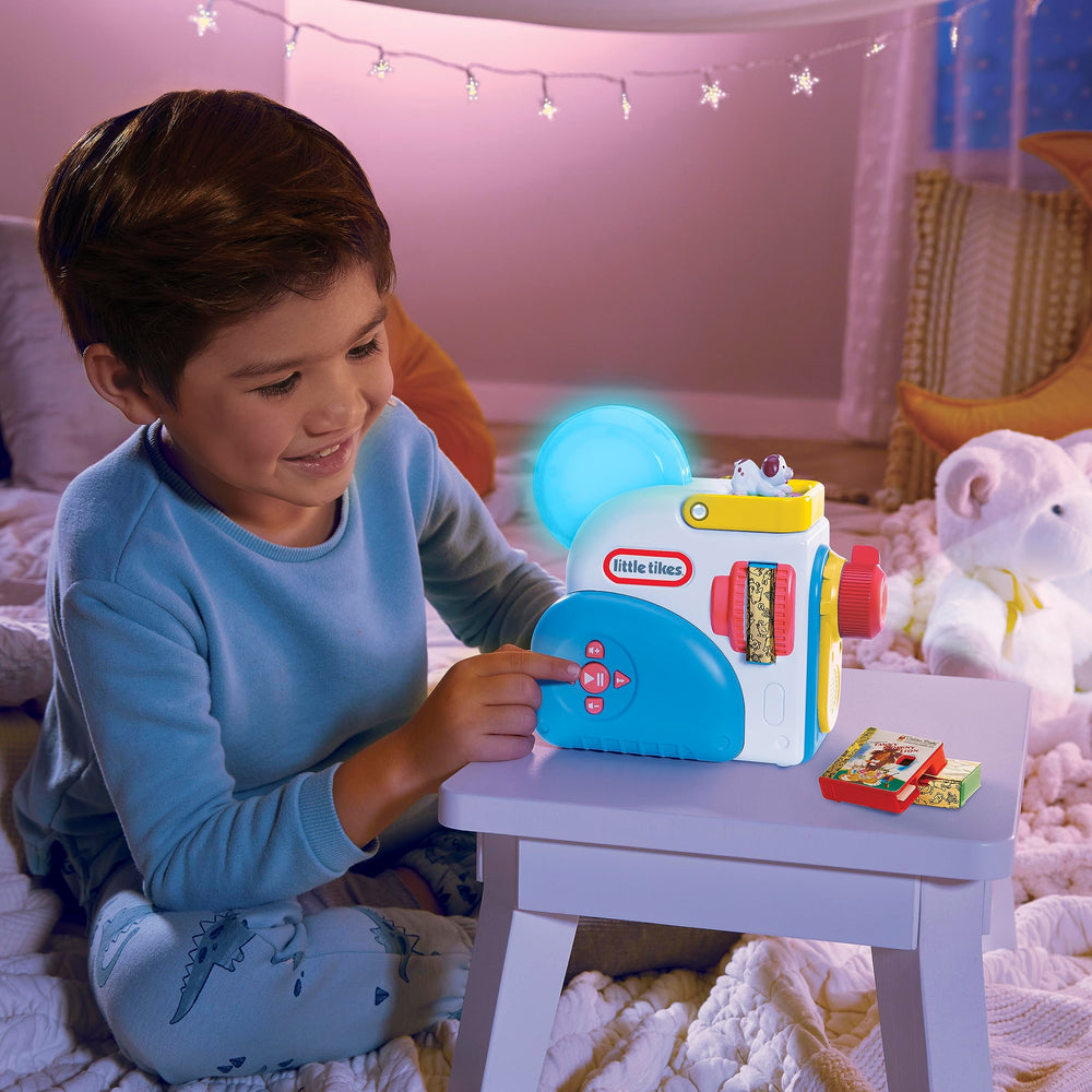 Little Tikes Story Dream Machine cartridge storage: side slots keep stories organized on the go.