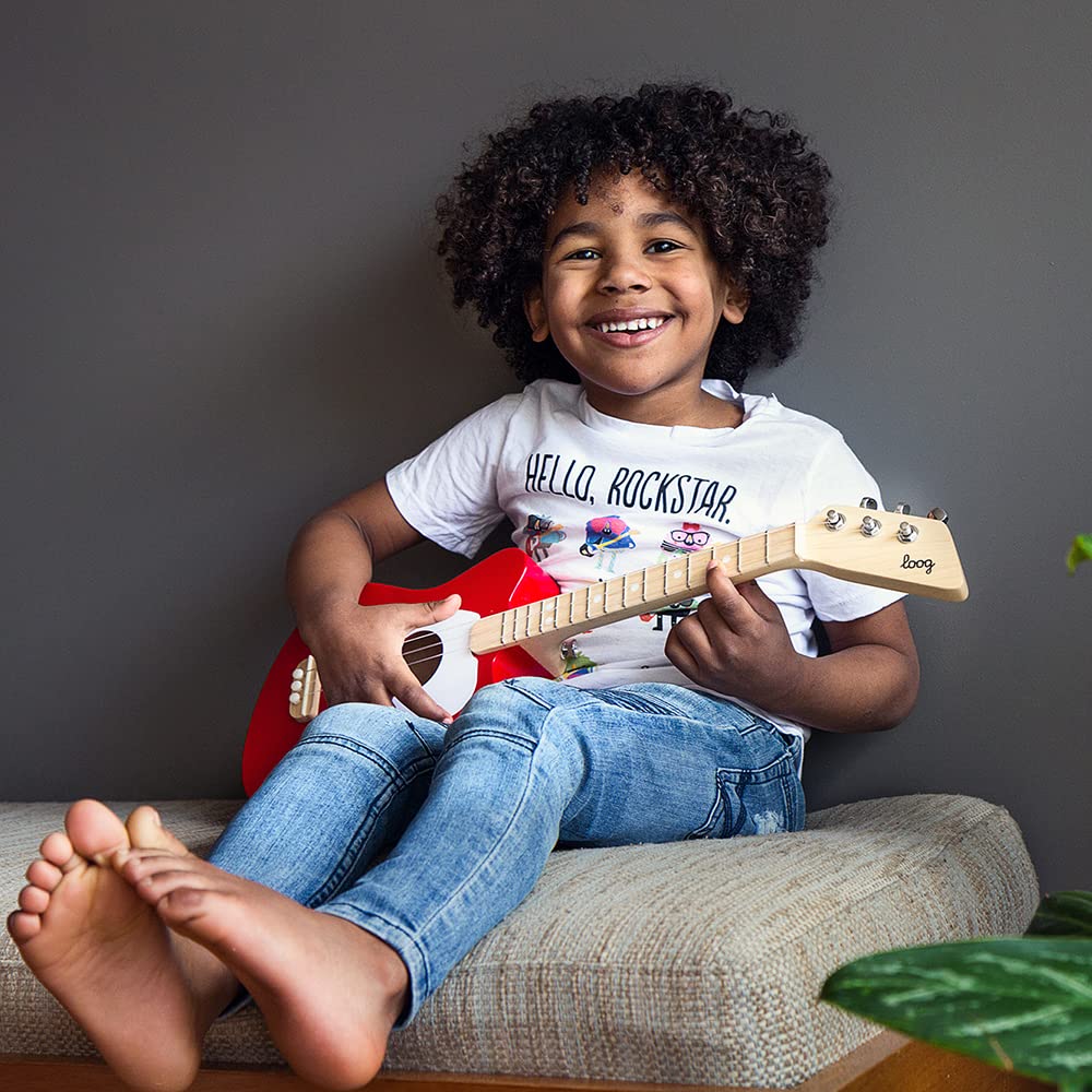 Loog Mini app interface on screen connects practice with progress tracking.