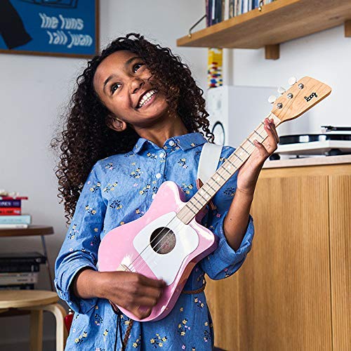 Loog Mini kid play session captures joyful learning moment.