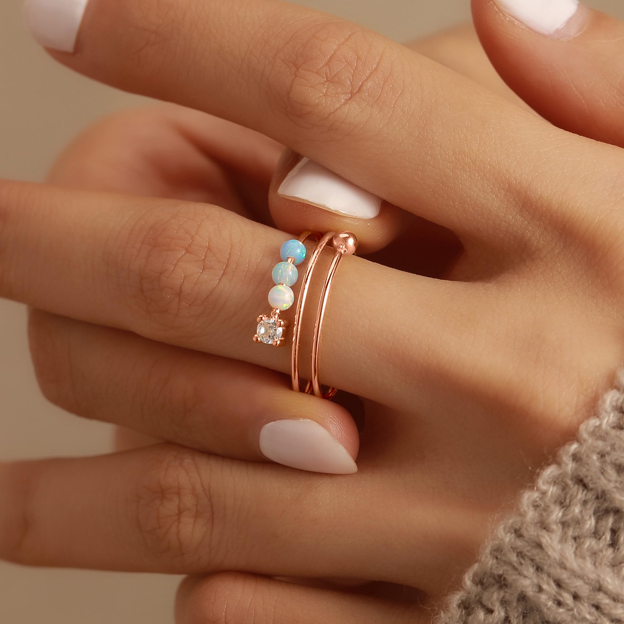 LOVECOM model wearing the rose gold opal fidget ring for daily wear.