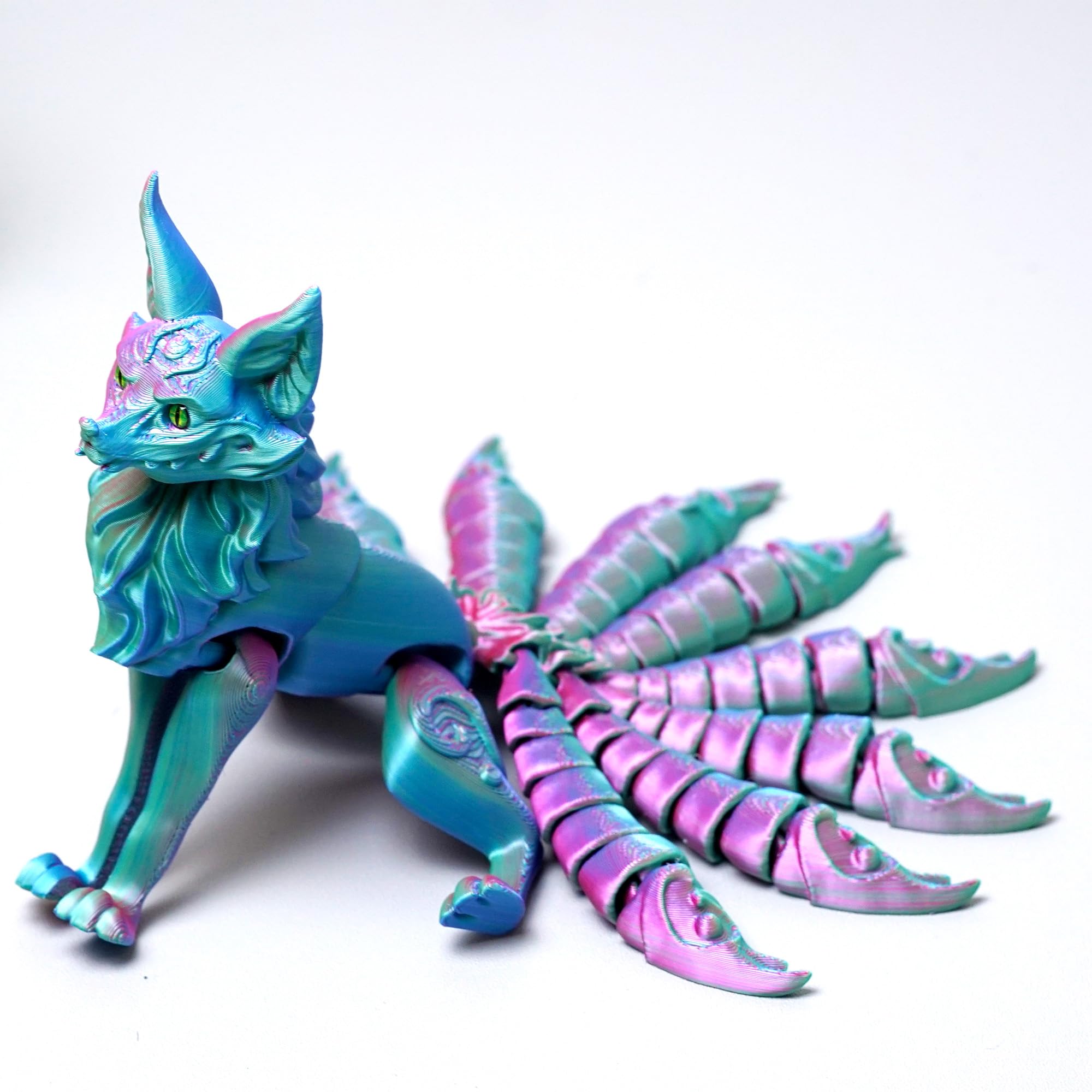 LUYUCUBE nine-tailed fox model on hand for portable fidget play.