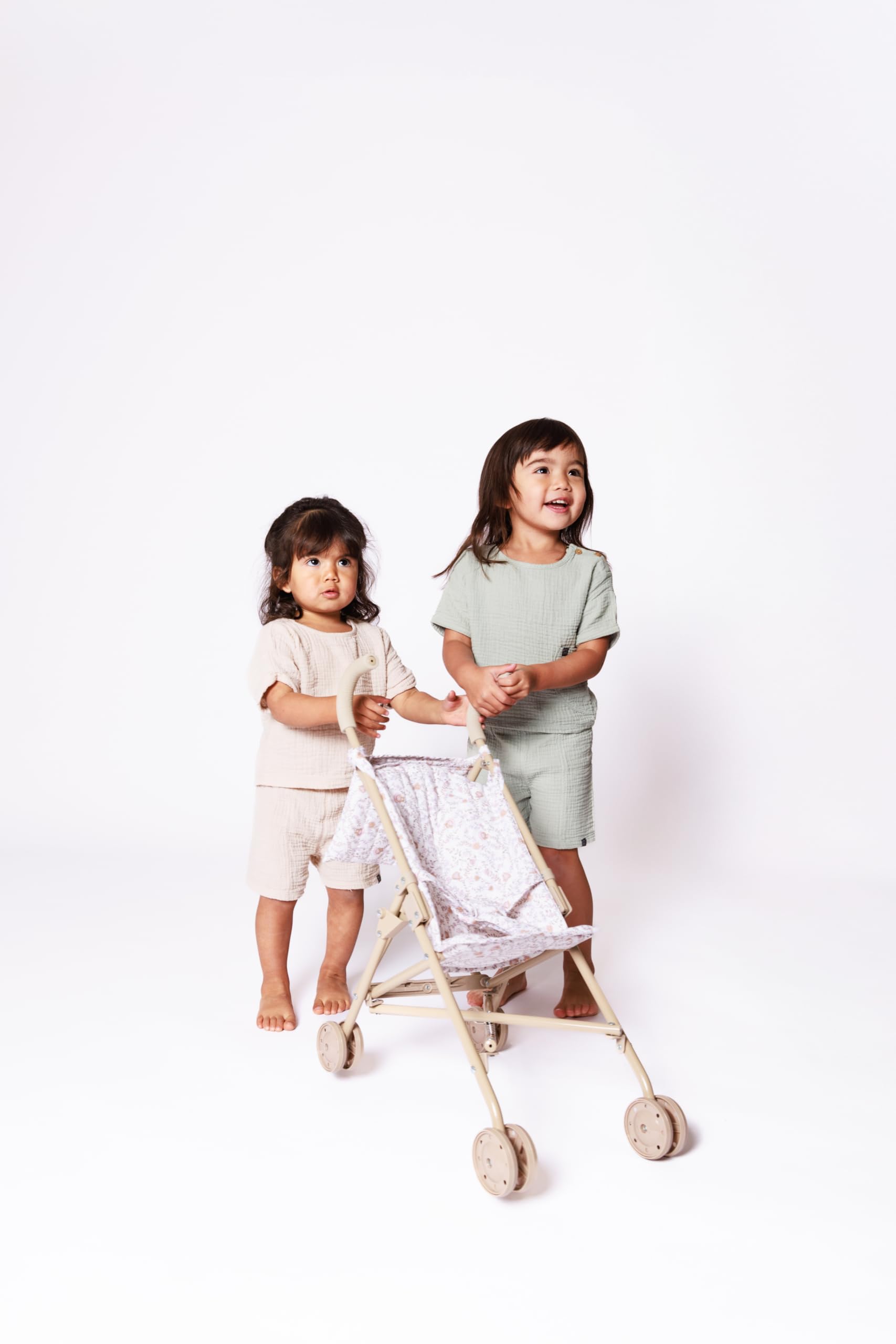 Lyla & Sage 22in beige stroller enhances imaginative doll play.