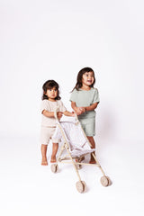 Lyla & Sage 22in beige stroller enhances imaginative doll play.