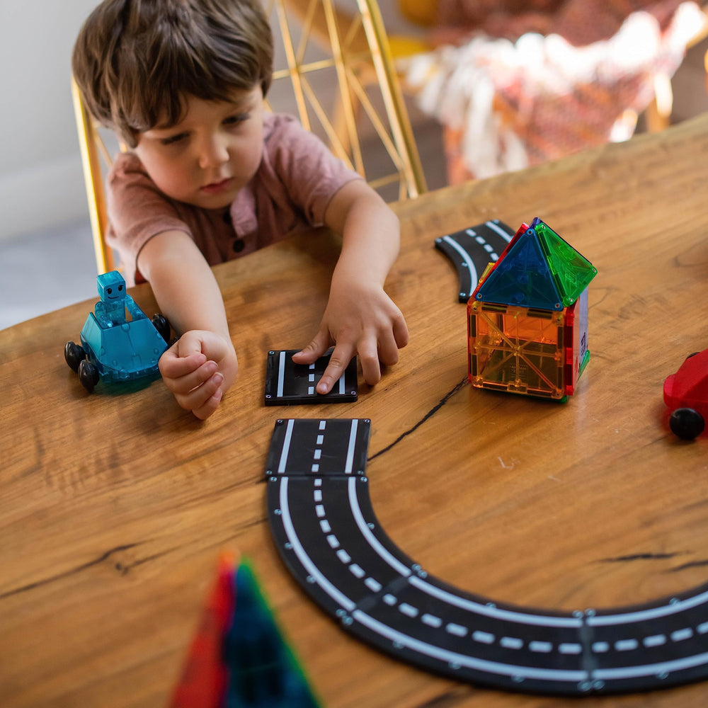 Curved road piece from MAGNA-TILES XTRAS Roads for winding routes.