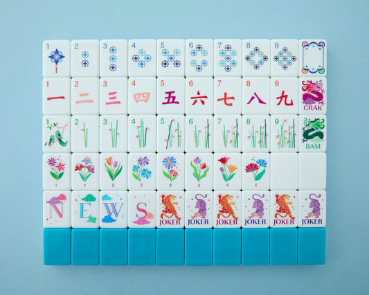 Mahjong Co Celestial teal-backed tiles for stylish, portable game nights.