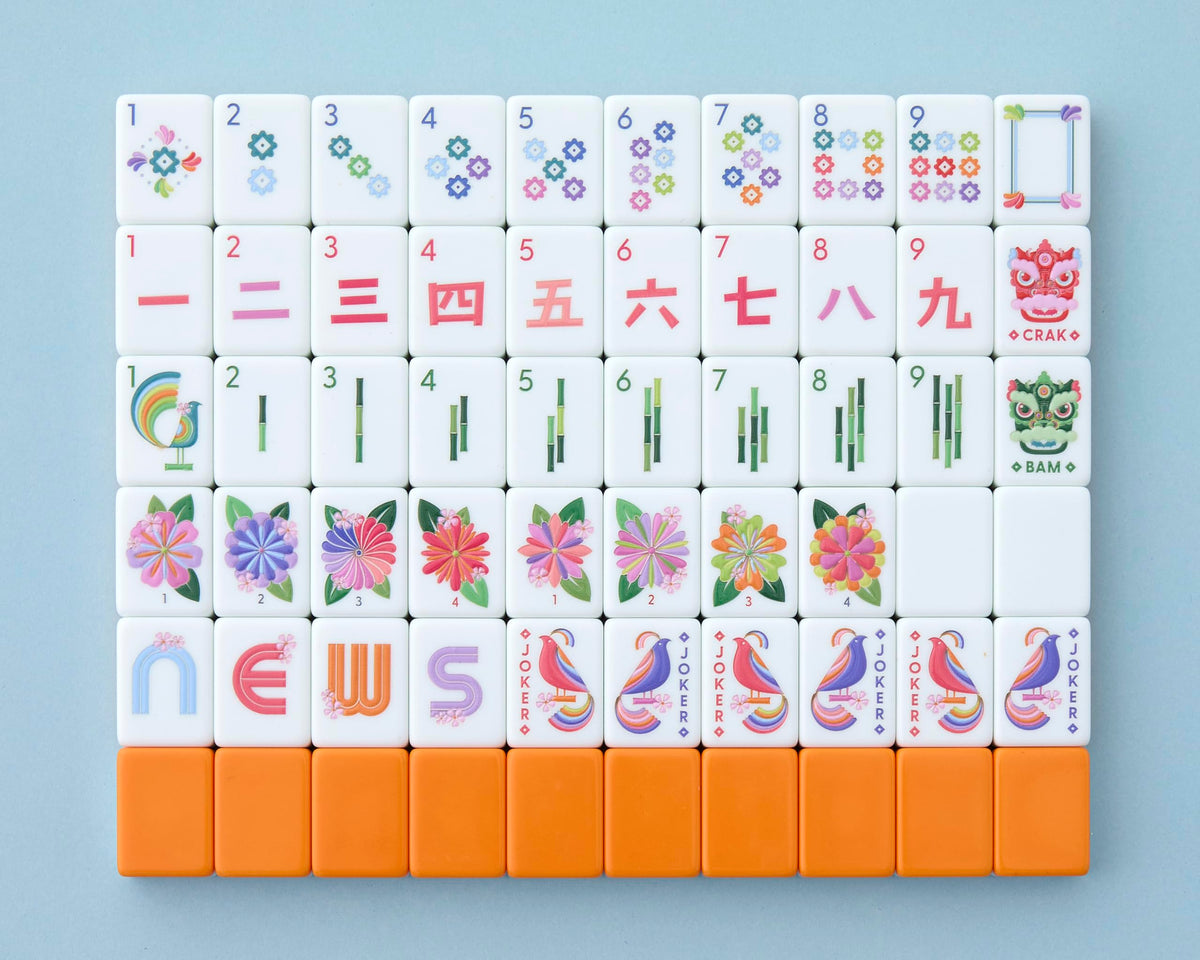 Paradise tiles by Mahjong Co. in front view show cosmic orange back and crisp artistry.