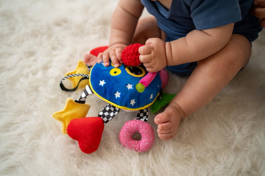 Baby Whoozit hidden-noisemaker arms provide crinkle, squeak, and rattle sounds
