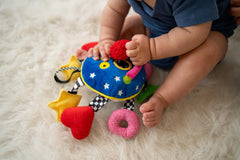 Baby Whoozit hidden-noisemaker arms provide crinkle, squeak, and rattle sounds
