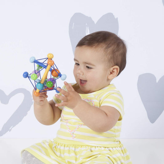 Manhattan Toy Skwish Color Burst dowels in motion inviting cause-and-effect exploration