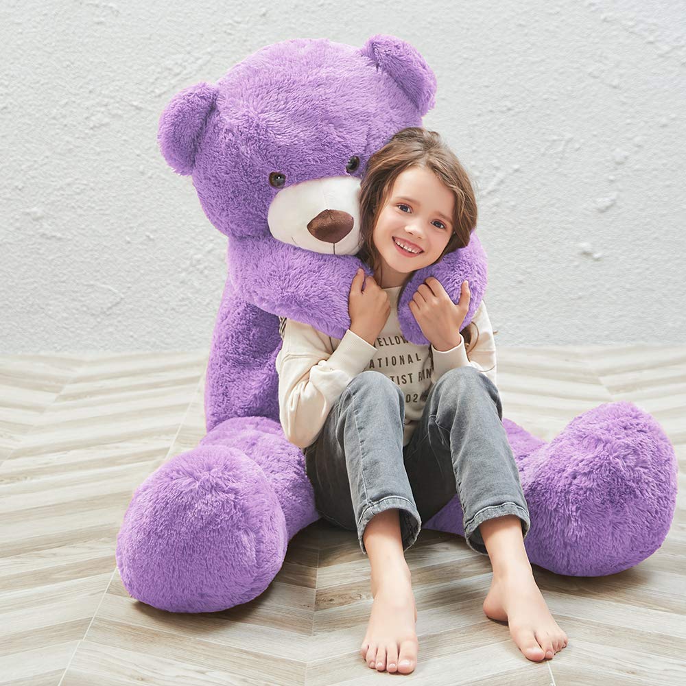 Close-up of MaoGoLan plush purple teddy bear texture and soft fibers.
