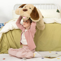 MaoGoLan plush dog on sofa provides a cuddly, comforting focal point.
